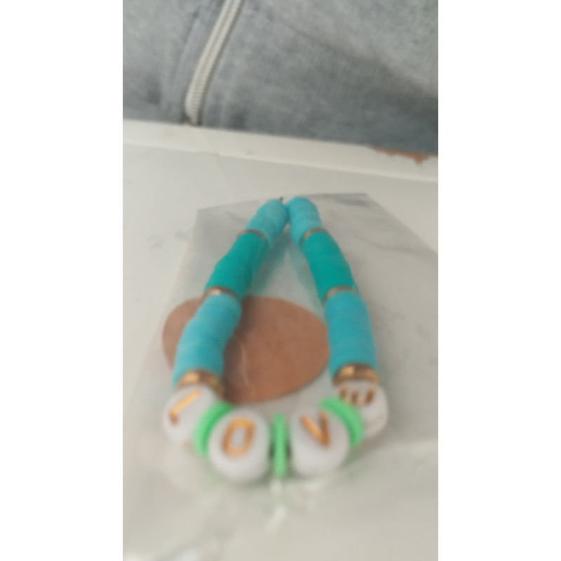 pulsera azul con círculos dorados con frase love(en el precio no están incluidos los gastos de envio)