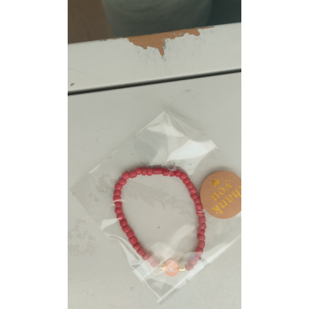 Pulsera roja con corazón naranja(en el precio no están incluidos los gastos de envio)