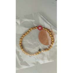 Pulsera dorada con corazón rojo(en el precio no están incluidos los gastos de envio)