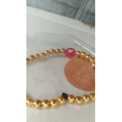 Pulsera dorada con corazón rojo(en el precio no están incluidos los gastos de envio)