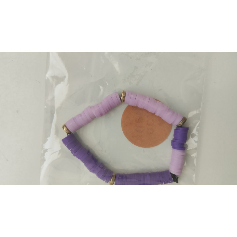 pulsera morada con arandeles dorados(en el precio no están incluidos los gastos de envio)